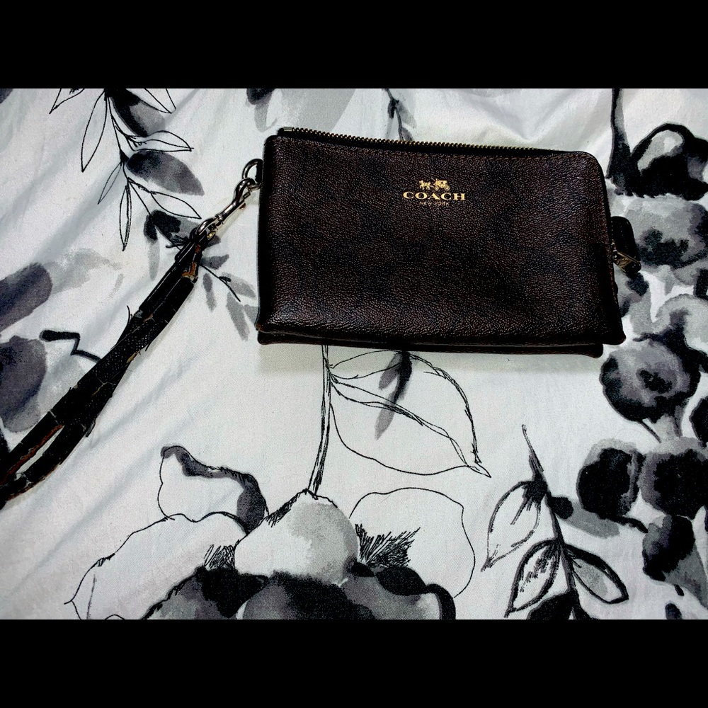 Authentic coach wallet. Some wear and tear on wrist strap and on corners.